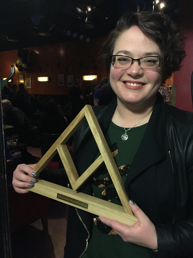 Gammelstads' winner Ulrika Fjellborg holding the handmade wooden trophy made by Finnish designer Tebian. Photo: The Finnish Salty Liquorice Association